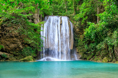 Waterfall cliff in deep forest, erawan national park, kanchanaburi, thailand