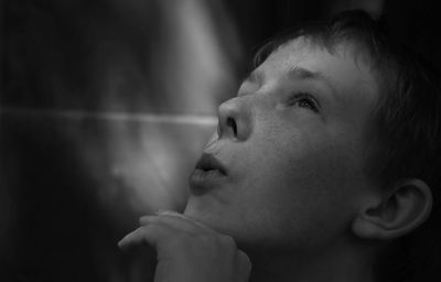 Close-up of young man looking up