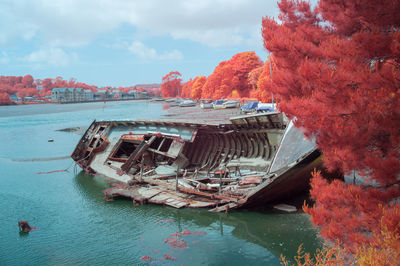 Fishing boat in sea against sky