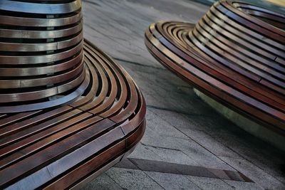 Tilt shot of wooden bench on footpath