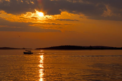 Scenic view of sea at sunset