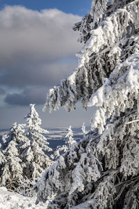 Scenic view of snow covered mountains against sky