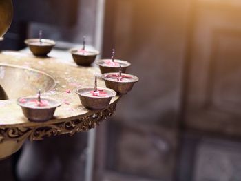 Close-up of candles on table