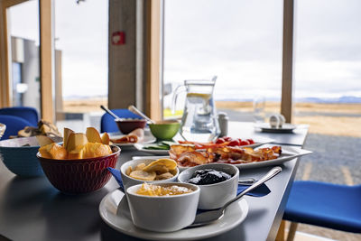 Healthy breakfast served on dining table against window with view at restaurant