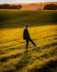 Full length of man standing on field