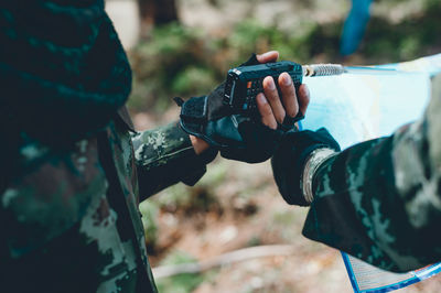 Close-up of man holding camera