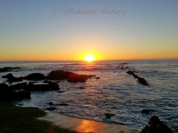 Scenic view of sea at sunset