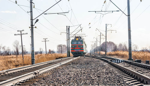 Train on railroad tracks against sky