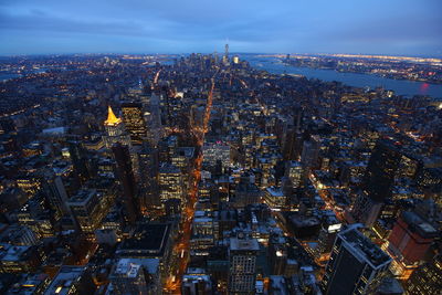 Aerial view of illuminated cityscape at night