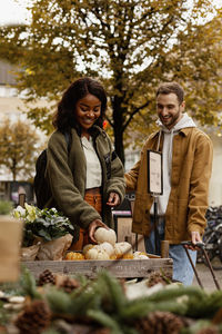 Young couple buying vegetables