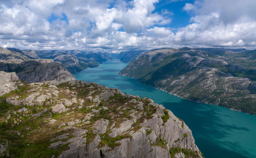 Panoramic view of sea and mountains against sky