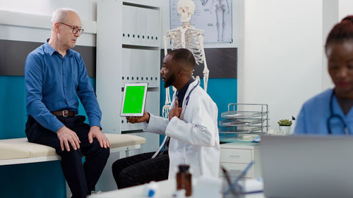 Doctor examining patient in laboratory