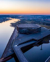 High angle view of bridge over river against sky during sunset