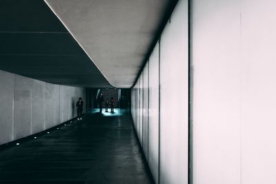 People walking in underground walkway 