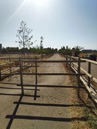 Fence on field against clear sky