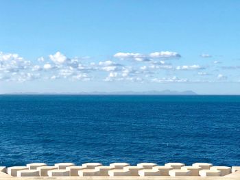 Scenic view of sea against blue sky