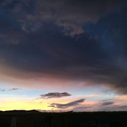 Silhouette landscape against sky during sunset