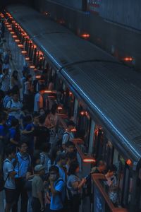 High angle view of people in illuminated city