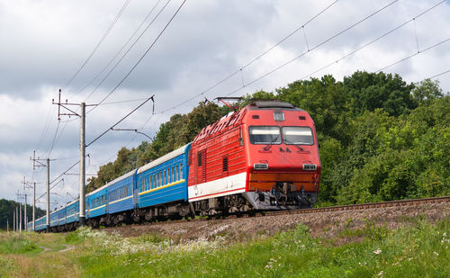 Train on railroad track against sky