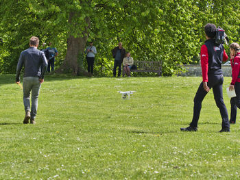 Group of people playing on grassland