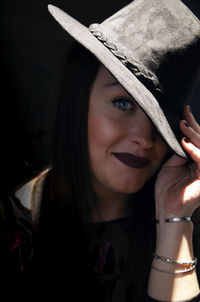Portrait of woman wearing hat
