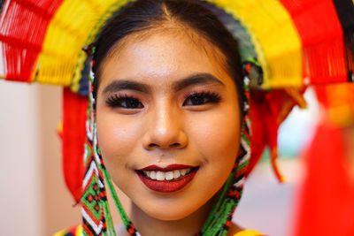 Close-up portrait of a smiling young woman