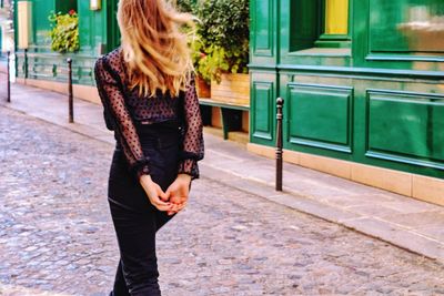 Woman standing on street