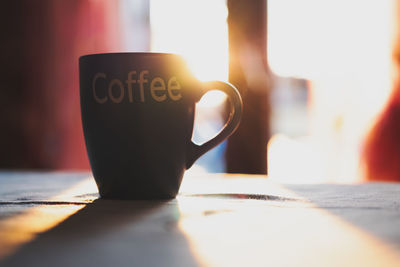 Close-up of coffee cup on table