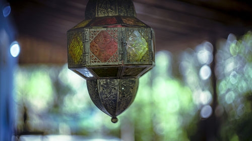 Low angle view of illuminated lanterns hanging on ceiling