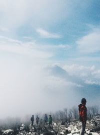 Rear view of man standing on mountain