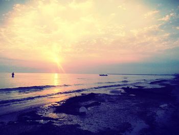 Scenic view of sea at sunset