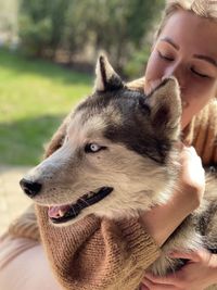 Close-up portrait of woman with dog