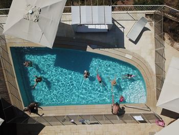 High angle view of people swimming in pool