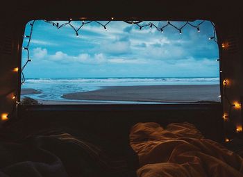 Scenic view of sea against cloudy sky