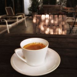 Close-up of coffee cup on table