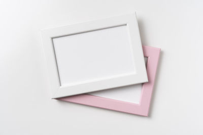 High angle view of paper over white background