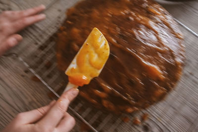 Close-up of hand holding ice cream