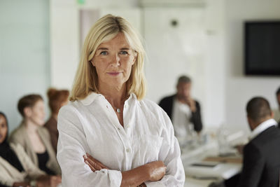 Businesswoman standing in boardroom