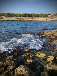 Scenic view of sea against clear sky