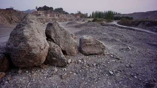 Rock formations on landscape against sky