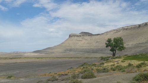 Scenic shot of mountain range against cloudy sky