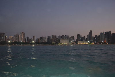 View of illuminated cityscape at dusk