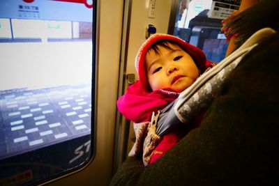 Portrait of baby in metro train