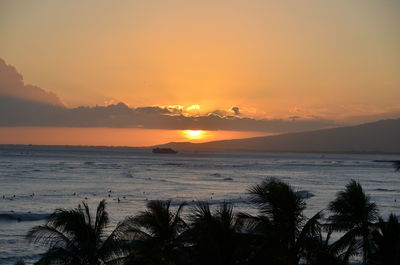 Scenic view of sea against romantic sky at sunset