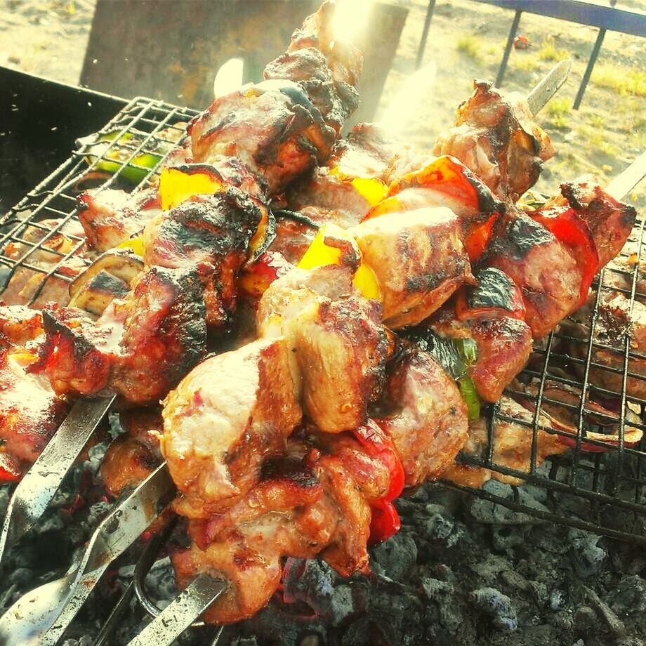 food and drink, food, meat, freshness, barbecue grill, barbecue, heat - temperature, cooking, grilled, healthy eating, preparation, indoors, fire - natural phenomenon, preparing food, high angle view, still life, roasted, flame, close-up, burning