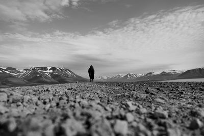 Full length of man standing on land against sky