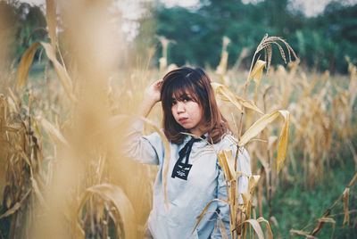 Woman standing on field