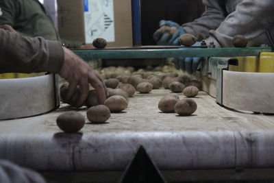 Person preparing food on table