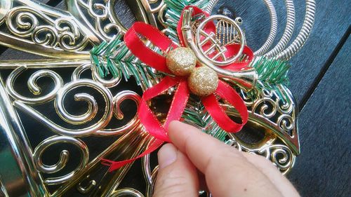 Close-up of hand holding christmas decoration