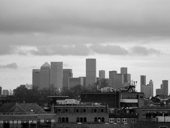 Buildings in city against sky